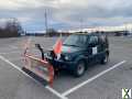 Foto Suzuki Jimny mit Scneeschild